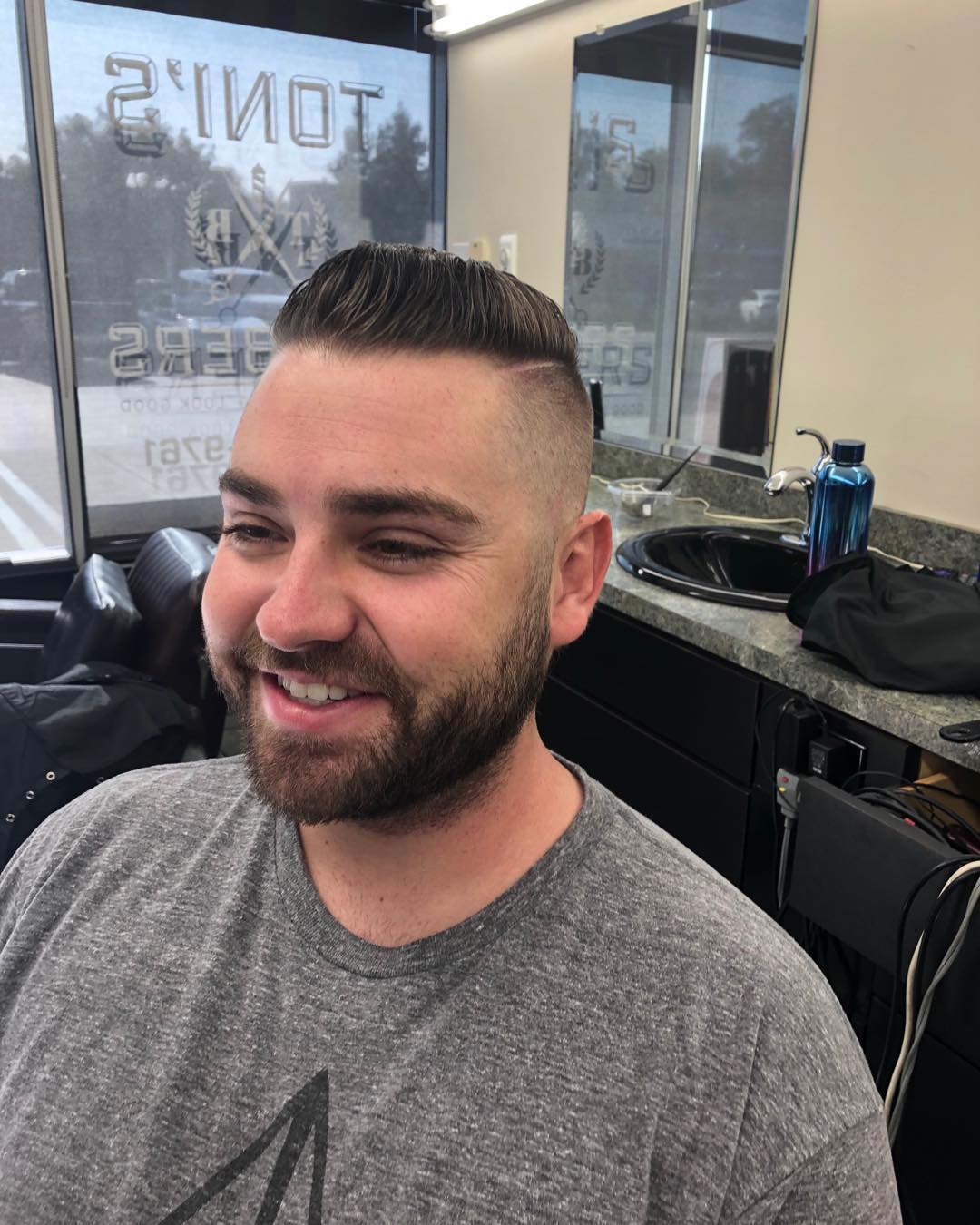 Classic fade with textured top and beard